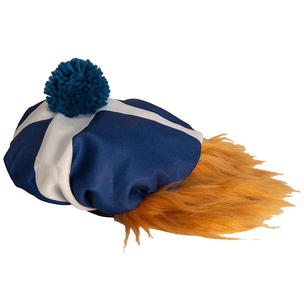 Blue and white fabric with a blue pom-pom and orange feathers on a white background