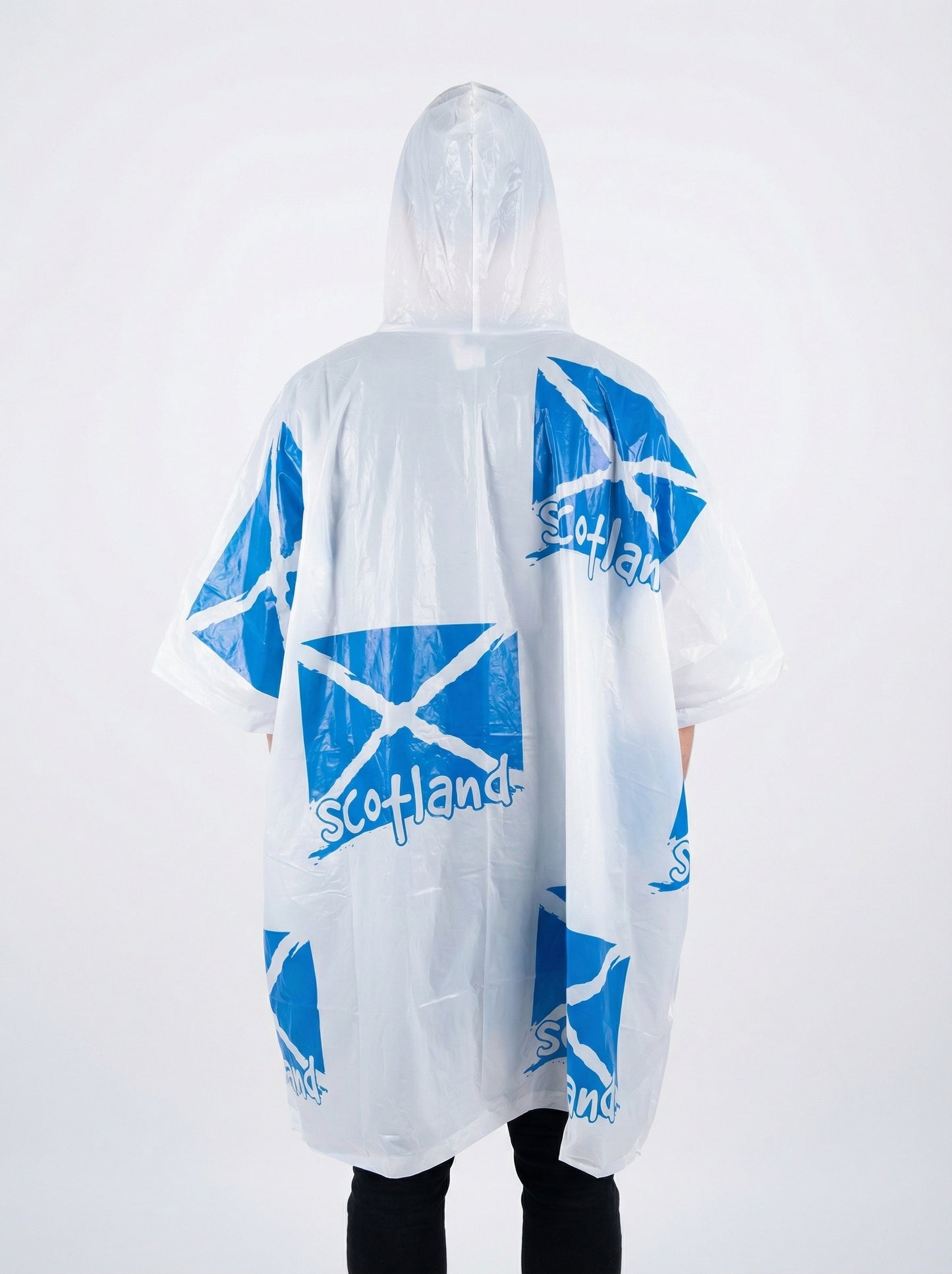 Model wearing a white poncho with scottish flags