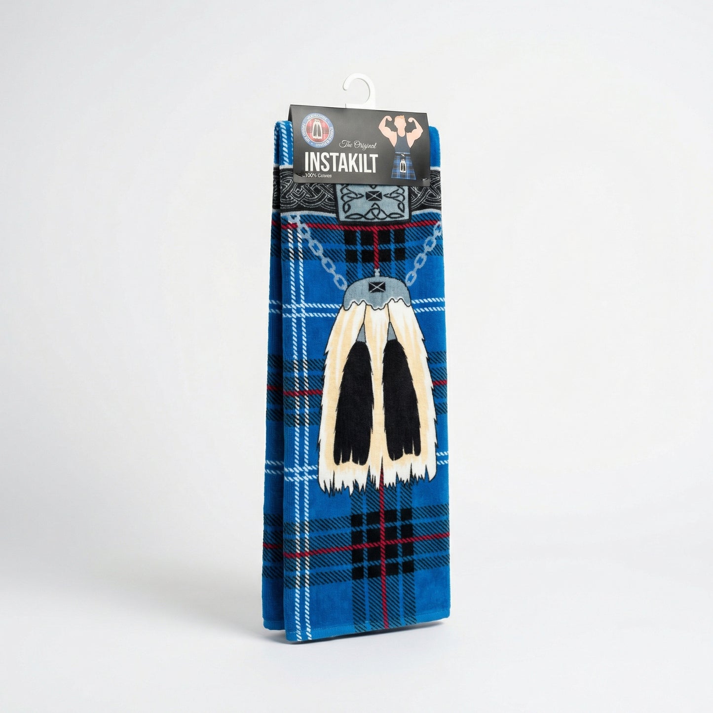 Packaged blue kilt beach towel with traditional sporran on a white background.