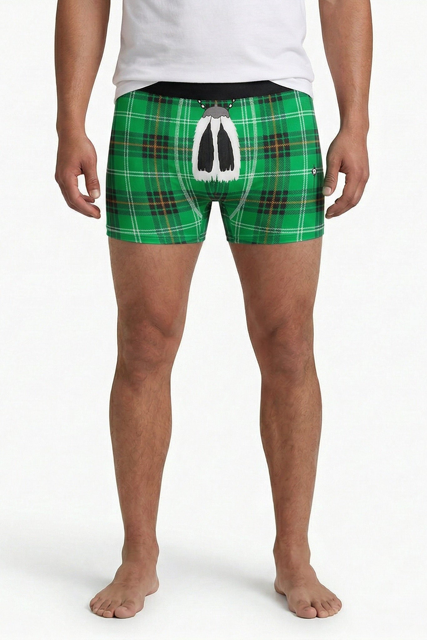 Man wearing green tartan boxers on a white background.