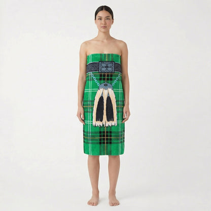 Woman wearing a green kilt beach towel with traditional sporran, on a white background.