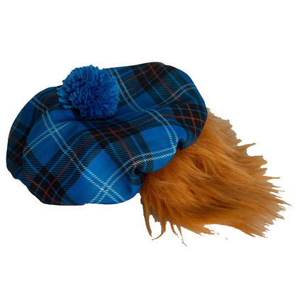 Blue tartan hat with a Blue pom-pom and ginger hair on a white background.
