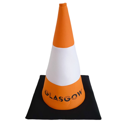 Orange and white traffic cone hat with 'Glasgow' text on a black base against a white background.