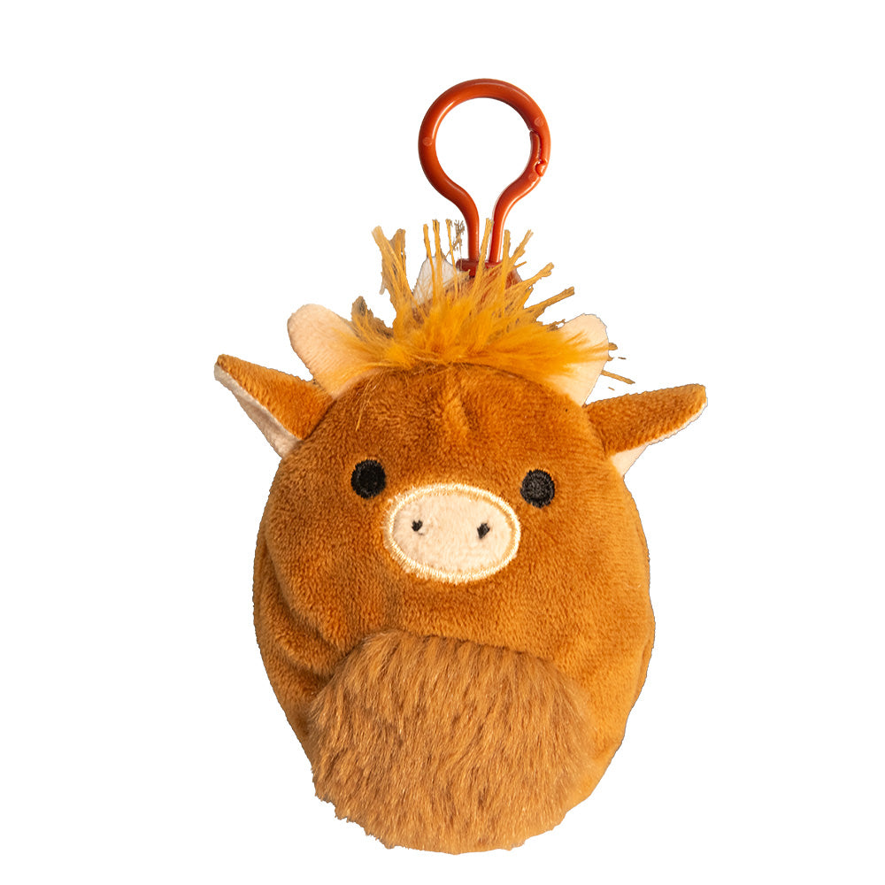 Plush toy keychain of a highland cow with a white muzzle on a white background.