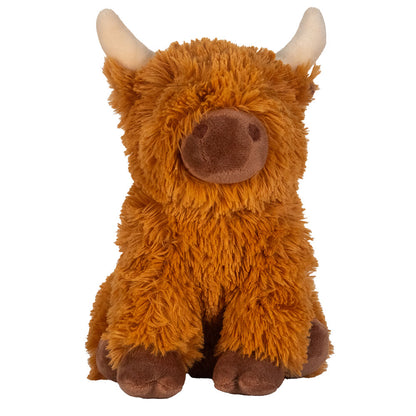 Plush toy cow with brown fur and white horns on a white background