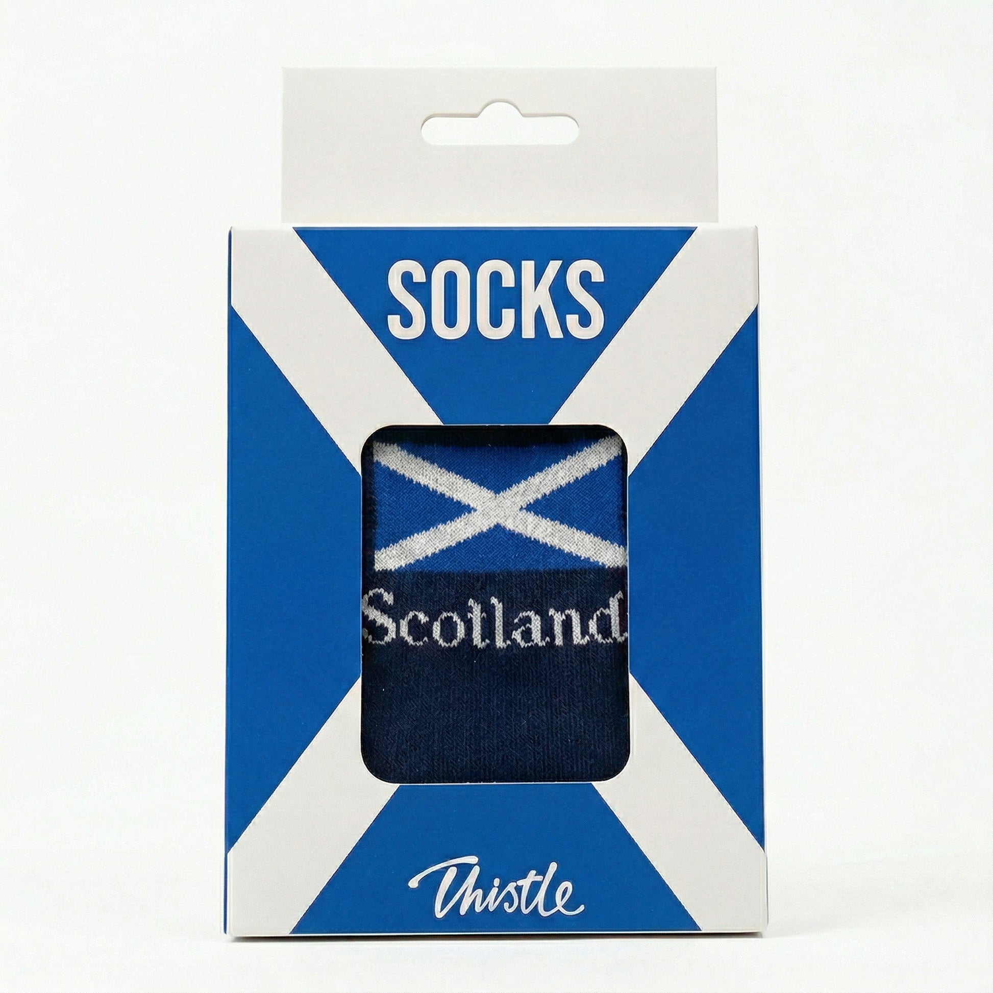 Packaged socks with Scottish flag design on a white background