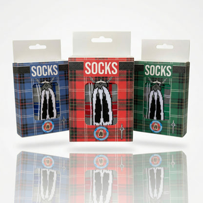 Three boxes of socks with tartan designs on a white background