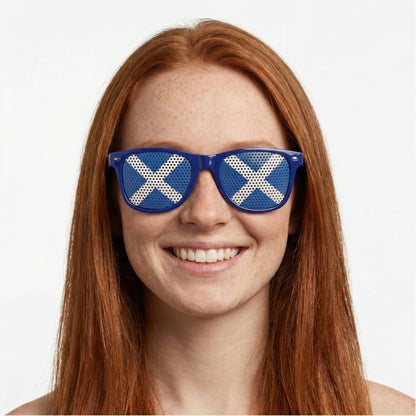Woman wearing blue sunglasses with Scottish flag on them.