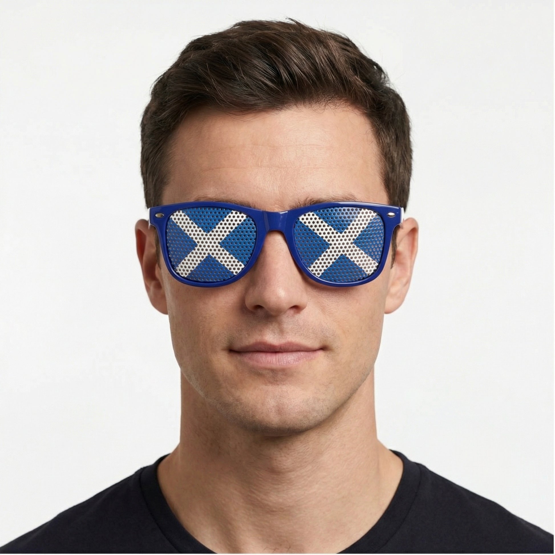 Man wearing blue sunglasses with Scottish flag on them.