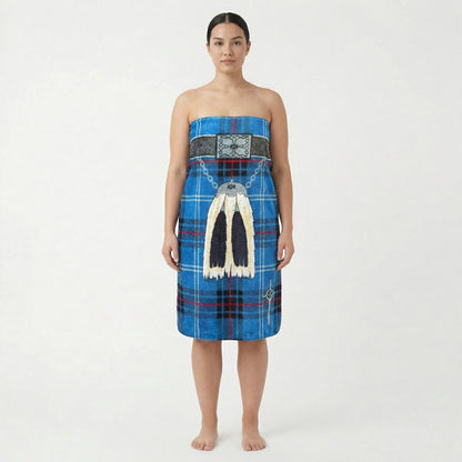 Woman wearing a wearing blue kilt beach towel with traditional sporran, on a white background.