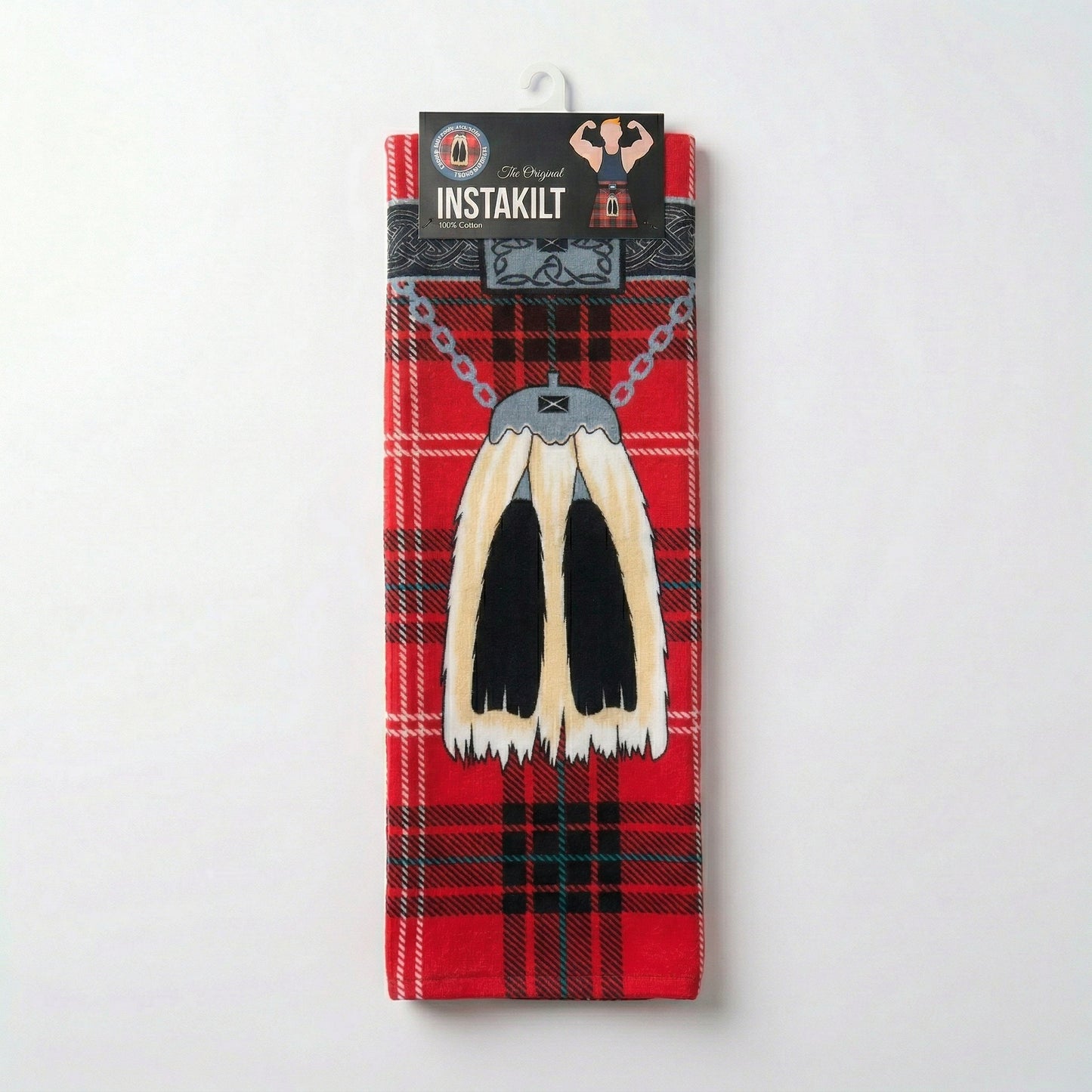 Red tartan kilt towel folded in packaging.