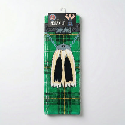 Green kilt beach towel with traditional sporran in packaging, on a white background.