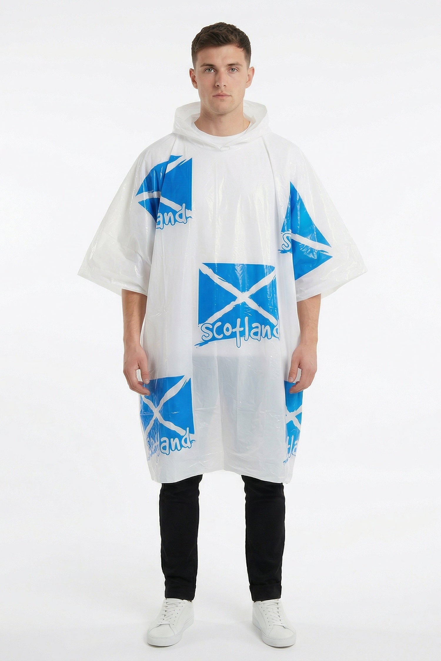 Person wearing a white poncho with blue patterns on a white background