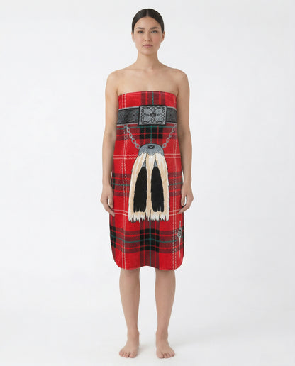 Woman wearing a red tartan towel with traditional sporran on a white background.